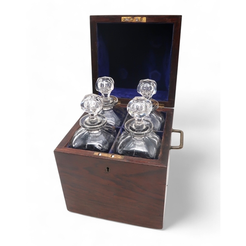 2284 - A 19TH CENTURY ROSEWOOD FOUR BOTTLE DECANTER BOXwith original four decanters and stoppers, the box w... 