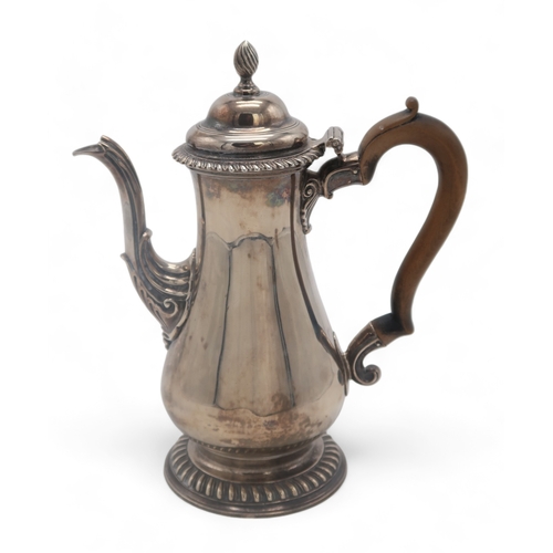 2501A - A GEORGE III SILVER COFFEE POTby William Grundy, London 1772, of plain baluster form, with a rococo ... 