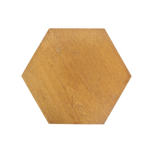 2067 - AN EARLY 20TH CENTURY OAK AFTER LIBERTY & CO HEXAGONAL OCCASIONAL TABLEwith hexagonal top over f... 