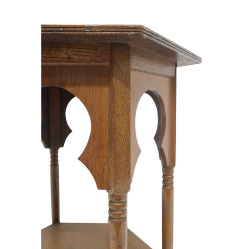 2067 - AN EARLY 20TH CENTURY OAK AFTER LIBERTY & CO HEXAGONAL OCCASIONAL TABLEwith hexagonal top over f... 