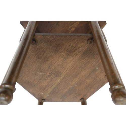 2067 - AN EARLY 20TH CENTURY OAK AFTER LIBERTY & CO HEXAGONAL OCCASIONAL TABLEwith hexagonal top over f... 