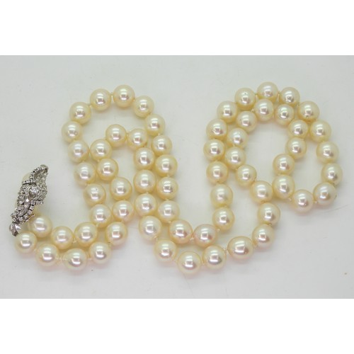 2733 - STATEMENT PEARLS & DIAMOND CLASPeach baroque pearl is approx 10.4mm to 10.9mm, length 86.5cm, th... 