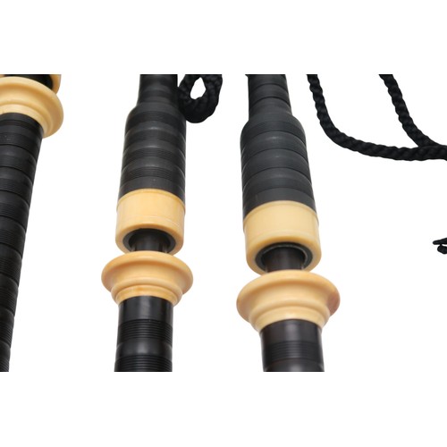 2642F - MACDOUGALL HIGHLAND BAGPIPESA set of full Scottish Highland bagpipes, ebonised with ivory mounts and... 