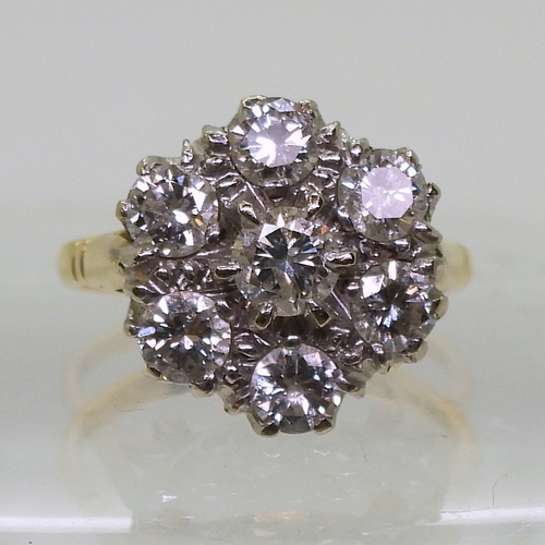 2821 - A DIAMOND FLOWER RINGmounted in 18ct yellow and white gold, set with estimated approx 1.50cts of bri... 