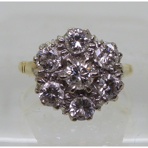 2821 - A DIAMOND FLOWER RINGmounted in 18ct yellow and white gold, set with estimated approx 1.50cts of bri... 