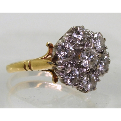 2821 - A DIAMOND FLOWER RINGmounted in 18ct yellow and white gold, set with estimated approx 1.50cts of bri... 