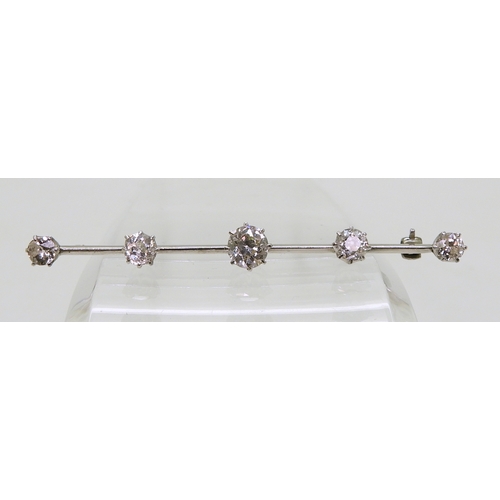 2822 - A SUBSTANTIAL DIAMOND BROOCHthe white metal bar brooch is stamped 18ct & Plat, and set with esti... 