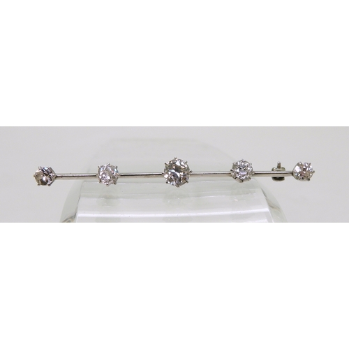 2822 - A SUBSTANTIAL DIAMOND BROOCHthe white metal bar brooch is stamped 18ct & Plat, and set with esti... 