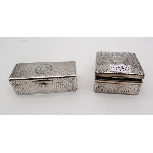 268A - A silver trinket box, by A & J Zimmerman, Birmingham, with a hammered finished and blank cartouc... 