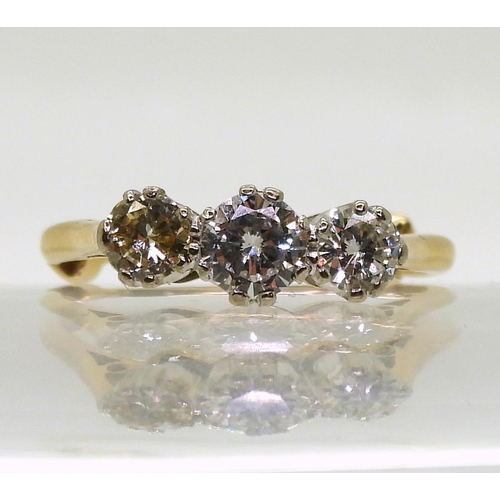 774 - A three stone diamond ring, made in bright yellow metal set with estimated approx 1ct in total of br... 