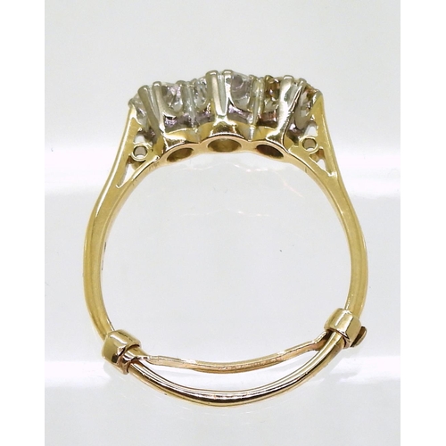 774 - A three stone diamond ring, made in bright yellow metal set with estimated approx 1ct in total of br... 