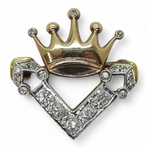 777 - An unusual diamond set crown brooch, set with estimated approx 0.40cts of brilliant and eight cut di... 