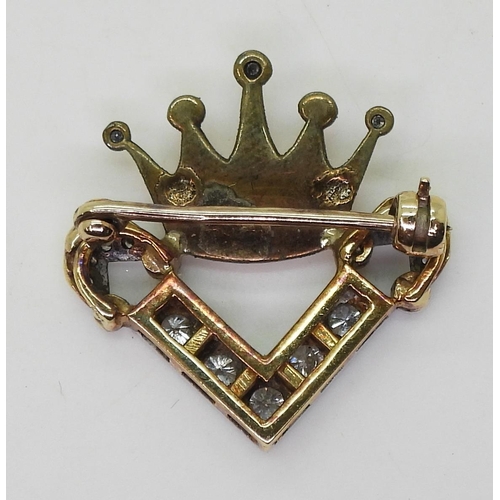 777 - An unusual diamond set crown brooch, set with estimated approx 0.40cts of brilliant and eight cut di... 