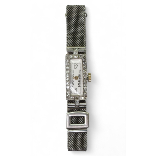 781 - A ladies platinum and diamond cocktail watch, with a 17 Jewel Swiss movement and a 9ct gold mesh str... 