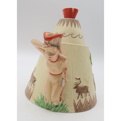 101 - A Clarice Cliff Greetings from Canada novelty teapot, the body modelled as a teepee, with figural sp... 