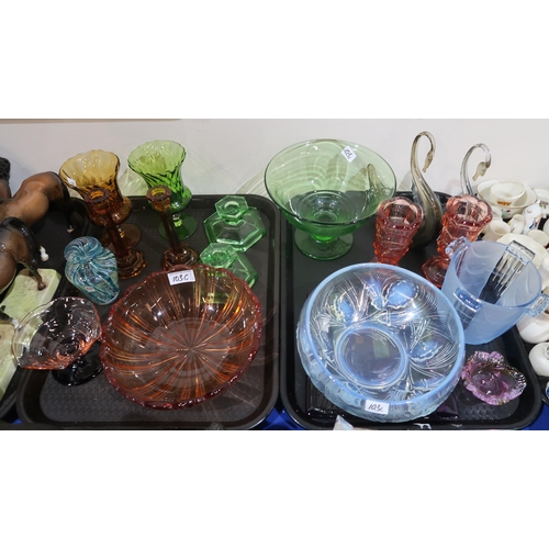 103C - A collection of coloured pressed glass items, including an opalescent pinecone decorated dish, candl... 