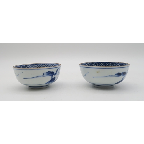 154 - Two Japanese porcelain bowls, decorated with flowers and central landscape