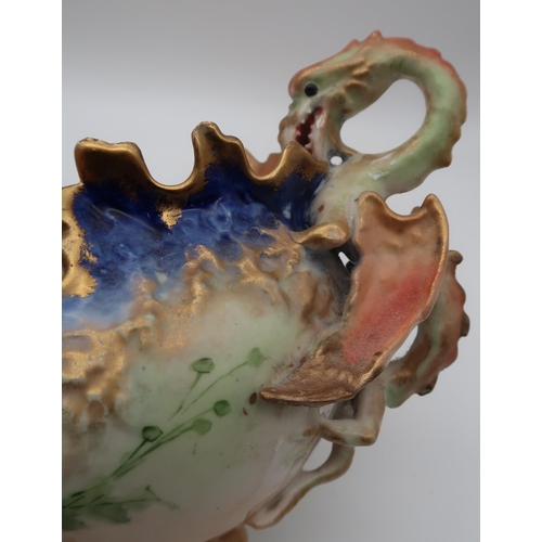 169 - A Nautilus porcelain ewer with snake handle, painted with poppies, together with a  twin handled com... 