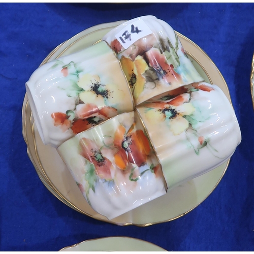 174 - Nautilus tea wares painted with poppies, painted with number 2/198 comprising seven cups and saucers... 