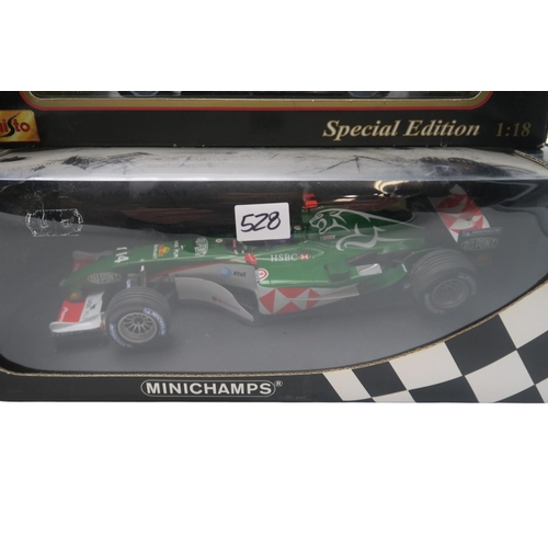 528 - A Minichamps 1:18-scale Jaguar Racing R5 M. Webber F1 car, two A Model Lotus 49B U.S.A. G.P. 68 Mari... 