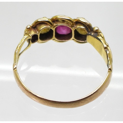 712 - A vintage bright yellow metal, ruby and pearl ring, size L1/2, weight 1.8gms