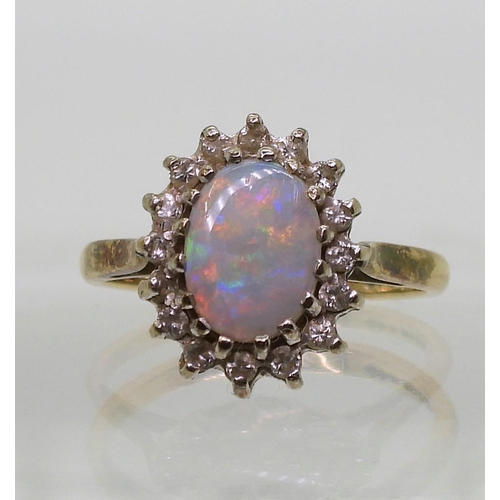 743 - A 9ct gold opal and diamond cluster ring, size K, weight 2.4gms