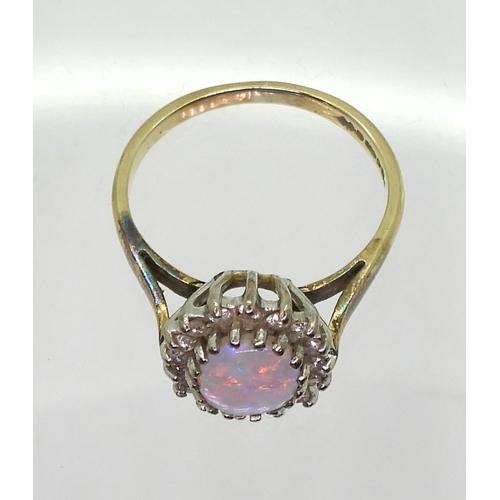 743 - A 9ct gold opal and diamond cluster ring, size K, weight 2.4gms