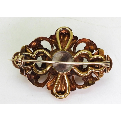 758 - A Victorian locket back brooch set with a large garnet of approx 14.5mm x 11.5mm, with engraved deta... 