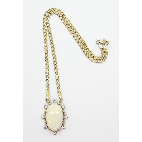 769 - A 9ct gold large white opal and diamond pendant, set with estimated approx 0.40cts of brilliant cut ... 