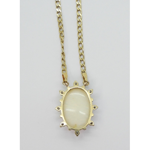 769 - A 9ct gold large white opal and diamond pendant, set with estimated approx 0.40cts of brilliant cut ... 