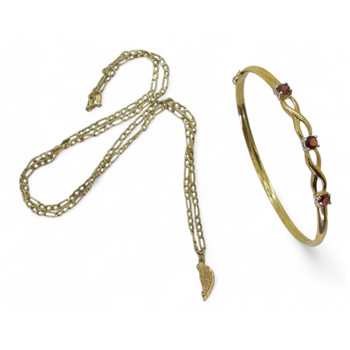 776 - A 9ct gold garnet bangle, and a 54cm figaro chain and pendant. Weight together 6gms.