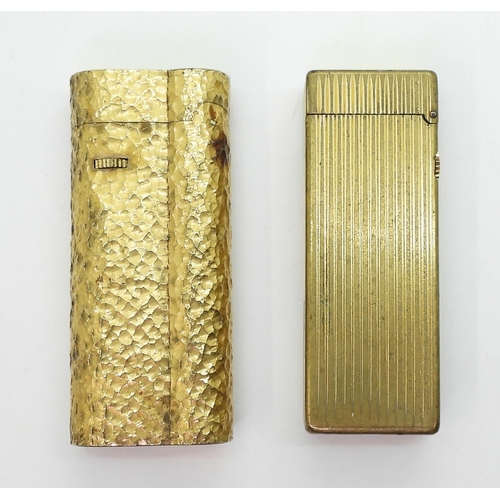 850 - Two gold plated vintage Dunhill lighters, together with a collection of silver and white metal chain... 