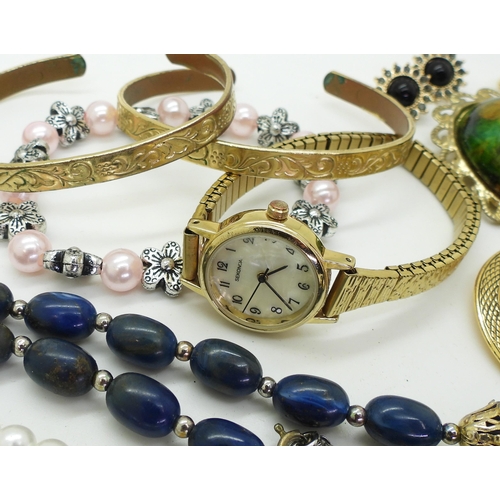 859 - A gold-plated Sekonda ladies watch, with a collection of vintage jewellery including various stud ea... 