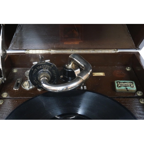 473 - A HMV GRAMOPHONE MODEL 109, in an oak case with associated spare needle tins by Columbia. And a quan... 