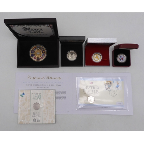 371A - A lot of various commemorative coins to include a Rudolph The Red Nosed Reindeer silver, gold plated... 