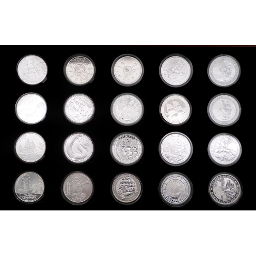 372 - A collector's case of sixty 1 oz silver commemorative novelty coins various themes approximately 168... 