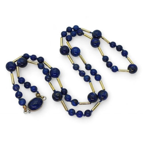 756 - Lapis lazuli beads, interspaced with bright yellow metal tube beads One stamped 750, length 68cm, we... 