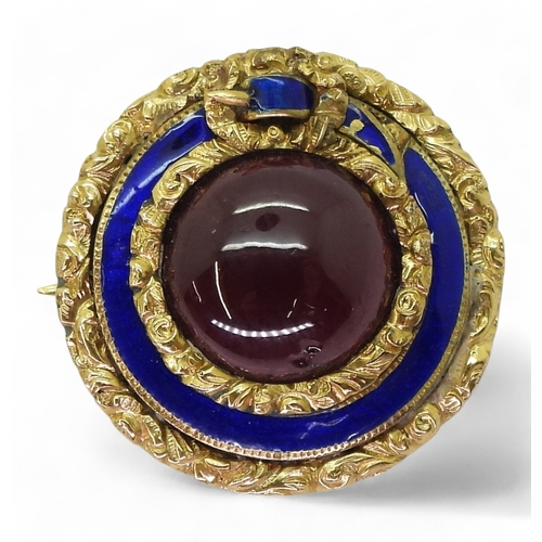 759 - A mourning brooch, made in bright yellow metal, with floral engraved and blue enamelled belt design ... 