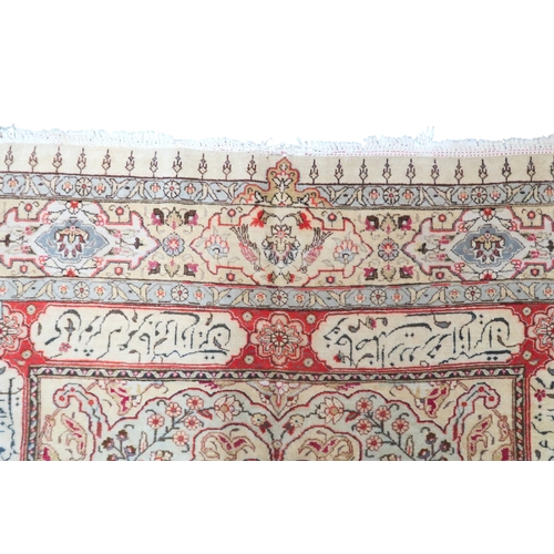 73 - AN IVORY GROUND UNIQUE TABRIZ RUG with floral patterned central medallion and spandrels on floral pa... 