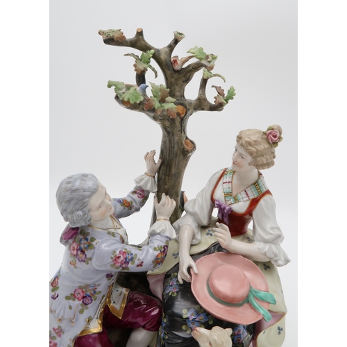 202 - A MULLER VOLKSTEDT DRESDEN GROUPmodelled as a couple beside a tree with a lamb at their feet, 28cm h... 