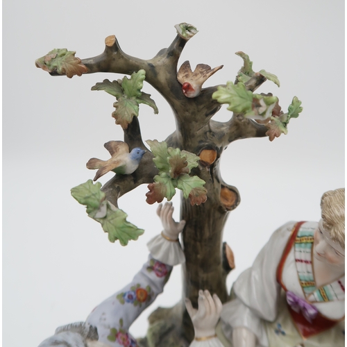 202 - A MULLER VOLKSTEDT DRESDEN GROUPmodelled as a couple beside a tree with a lamb at their feet, 28cm h... 