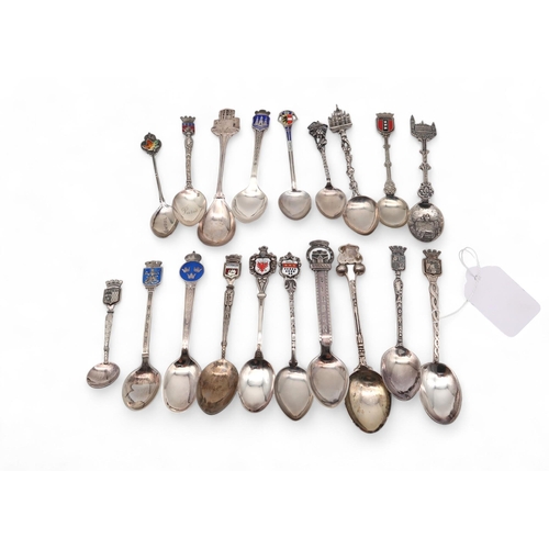 421 - A collection of enamel souvenir spoons, comprising stamped 800 examples, sterling examples, a Norweg... 