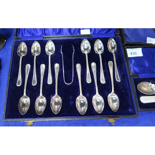 430 - A collection of EPNS including a three piece tea service, cased teaspoons and sugar tongs, a silver-... 