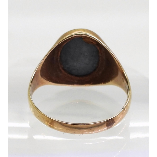 707 - A 9ct gold centurion carved haematite signet ring, size 2 (Gents size) weight 6.1gms