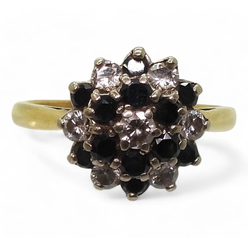 734 - An 18ct gold sapphire and diamond retro cluster ring set with estimated approx 0.35cts of brilliant ... 