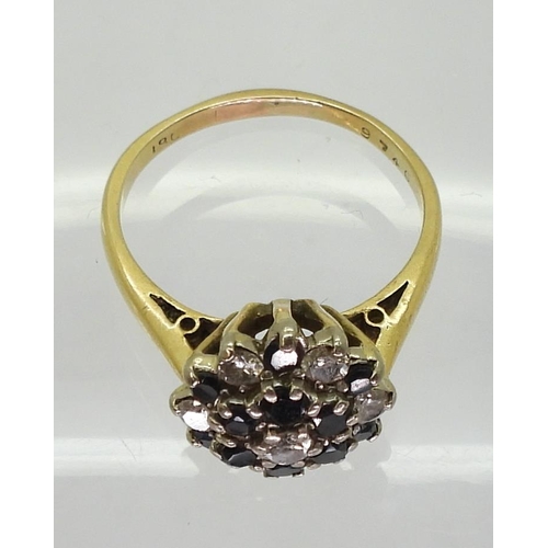 734 - An 18ct gold sapphire and diamond retro cluster ring set with estimated approx 0.35cts of brilliant ... 