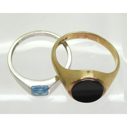 740 - A 9ct white gold ring set with a blue topaz, size P1/2, a 9ct gold onyx signet ring, size T, weight ... 