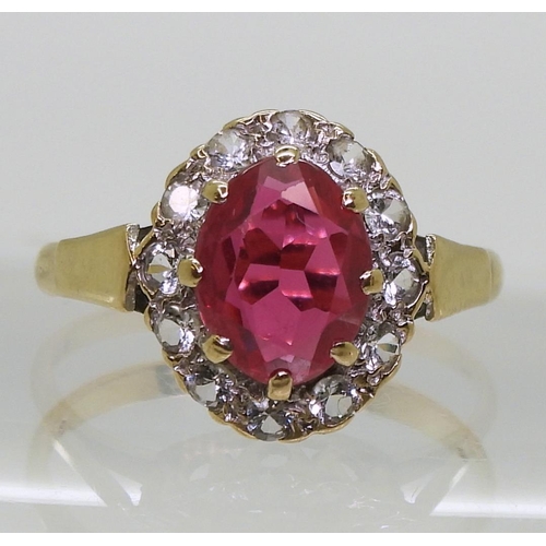 741 - A 9ct gold red and clear gem set ring, size O1/2, weight 2.5gms