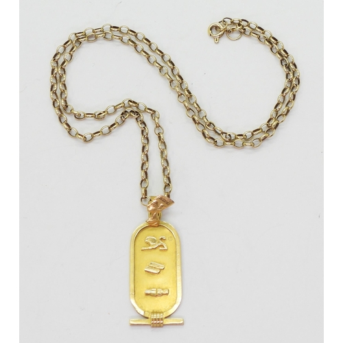 753 - An Egyptian gold pendant, with Arabic gold marks, weight 2.6gms, together with a 42cm 9ct gold chain... 