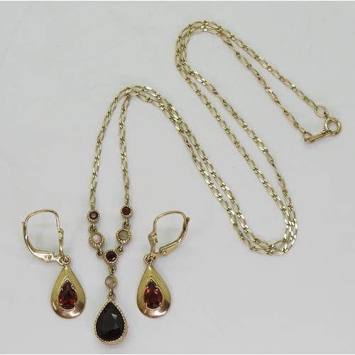 774 - A 9ct gold garnet and mother of pearl necklace together with a pair of garnet earrings, weight combi... 